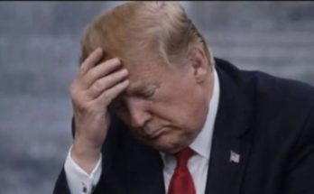 Donald Trump standing quietly in Washington