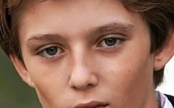 Barron Trump standing reserved at public event