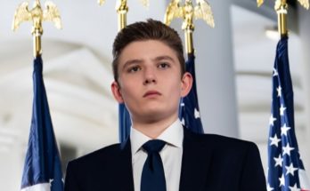 Barron Trump standing quietly at public event