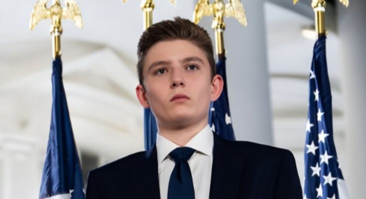 Barron Trump standing quietly at public event