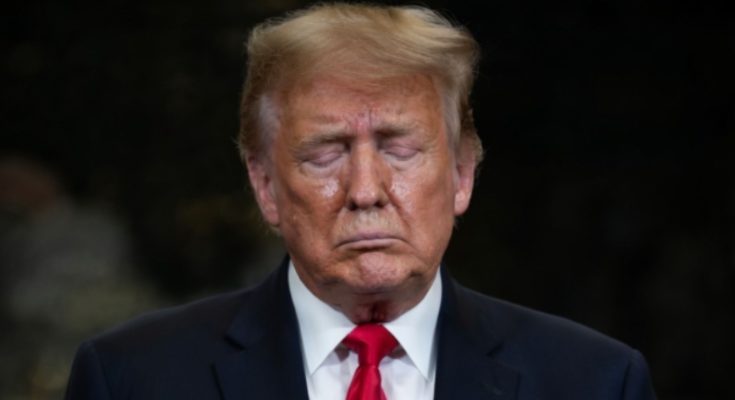 Donald Trump standing quietly in Washington