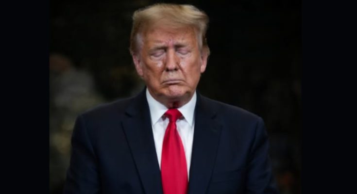 Donald Trump standing quietly in Washington