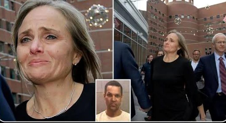 Woman crying outside courthouse with legal team