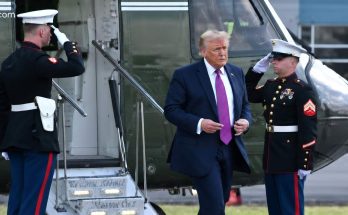 Donald Trump exiting helicopter with Marine honor guard