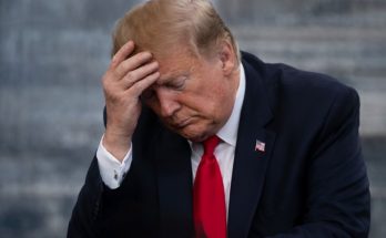 Donald Trump with hand on forehead