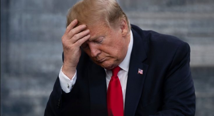 Donald Trump with hand on forehead