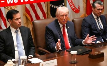 Donald Trump speaking at a meeting with officials