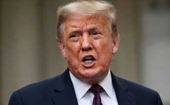 Donald Trump speaking outdoors