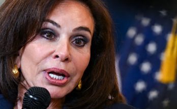 Kamala Harris speaking into microphone