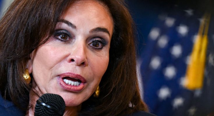 Kamala Harris speaking into microphone