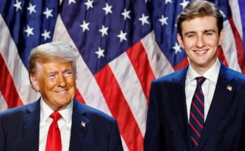 Barron Trump standing quietly at public event