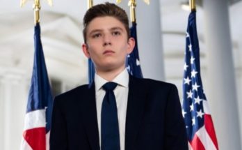 Young man in suit with American flags