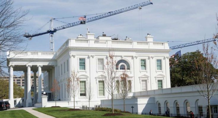 White House under construction with cranes