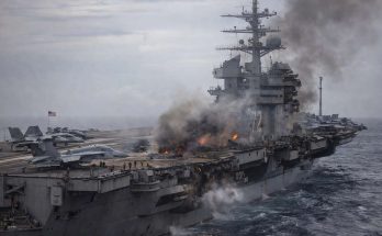 Aircraft carrier on fire at sea