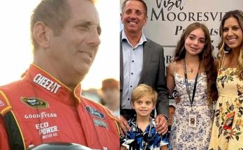 racing legend at event with family in Mooresville backdrop