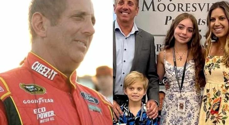racing legend at event with family in Mooresville backdrop