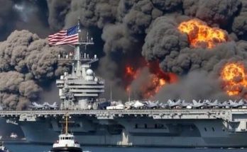 u.S. aircraft carrier with American flag burns intensely as massive black smoke plumes