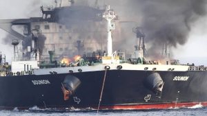 large tanker ship Solunion on fire with thick black smoke rising from deck amid ocean
