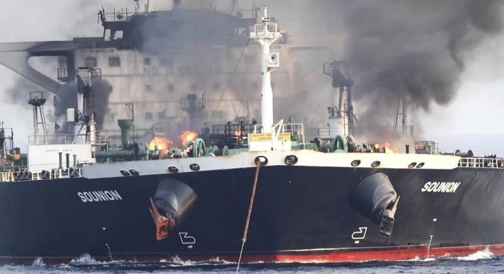 large tanker ship Solunion on fire with thick black smoke rising from deck amid ocean