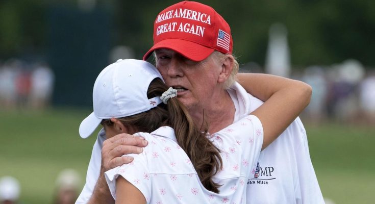 Trump hugs young woman on golf course