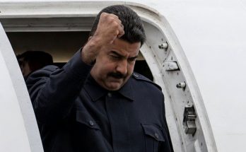 Nicolas Maduro fist salute from plane
