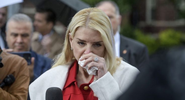 ivanka Trump wipes tears while speaking to reporters outdoors in rain