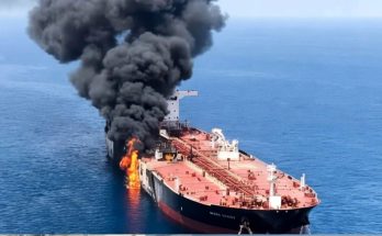 Burning oil tanker ship at sea