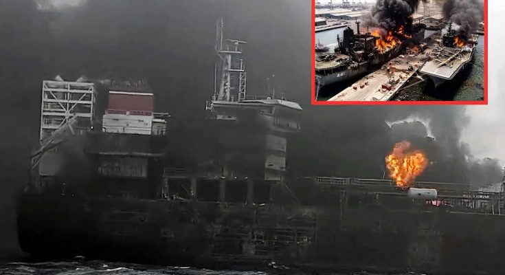 burning ship in harbor with thick smoke and flames