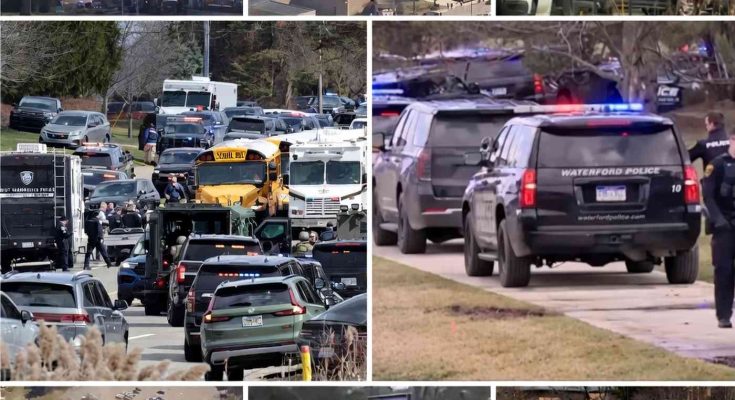 waterford Police SUVs with flashing lights respond to emergency scene with school bus and