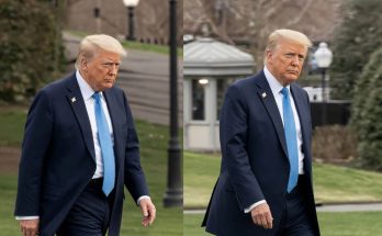 Donald Trump walking in blue suit and tie