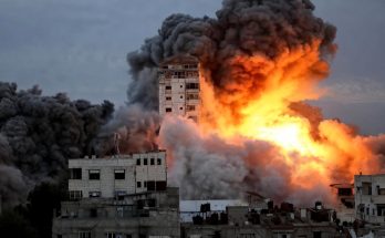 Massive explosion in urban area with black smoke