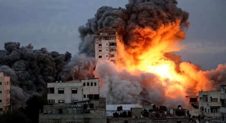 Massive explosion in urban area with black smoke