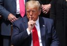 Trump shushing with finger to lips
