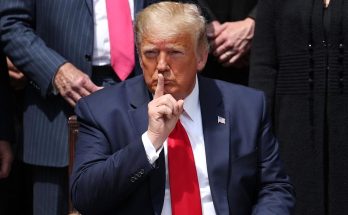 Trump shushing with finger to lips