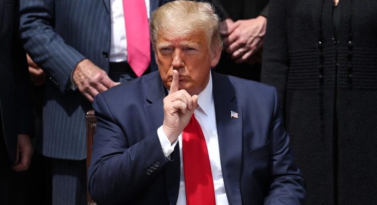 Trump shushing with finger to lips