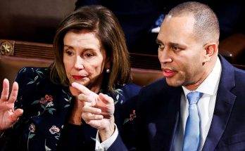 nancy Pelosi and Rep. Hakeem Jeffries engaged in a serious conversation during a