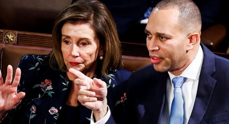 nancy Pelosi and Rep. Hakeem Jeffries engaged in a serious conversation during a