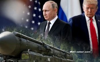 vladimir Putin and Donald Trump stand beside a Russian missile launcher with U.S. and