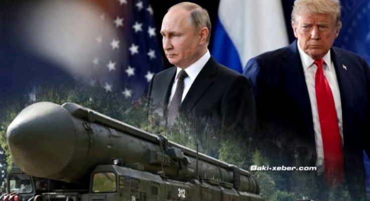 vladimir Putin and Donald Trump stand beside a Russian missile launcher with U.S. and