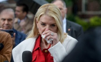pam Bondi wipes her eye with tissue during emotional outdoor press conference