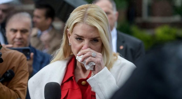 pam Bondi wipes her eye with tissue during emotional outdoor press conference