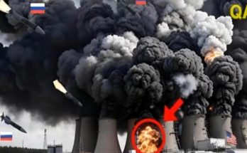 russian missiles strike power plant cooling towers with massive black smoke plumes rising