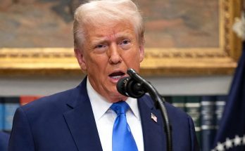 Donald Trump speaking at podium