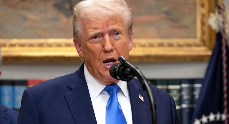 Donald Trump speaking at podium