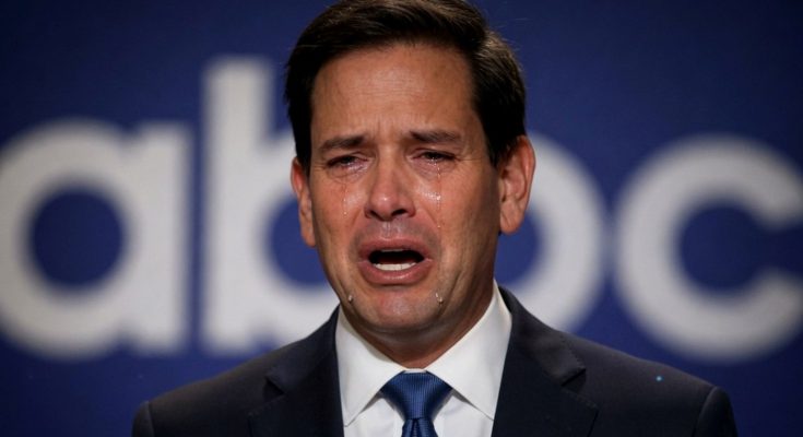 Emotional man in suit crying during speech