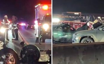 emergency responders at night scene of multi-vehicle crash with damaged cars and