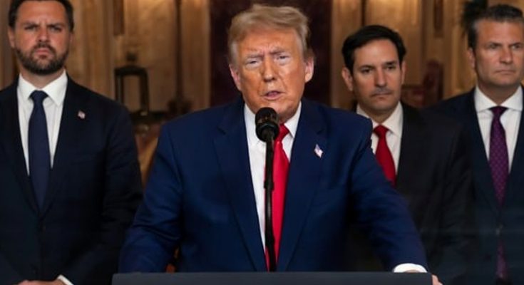 former President Donald Trump speaking at podium with three men in suits standing behind