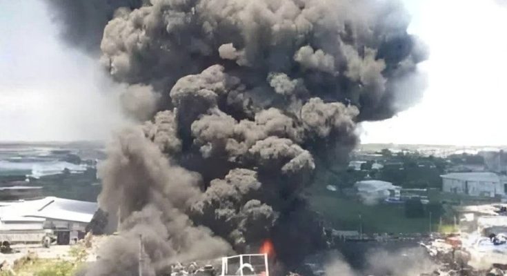 Massive explosion with black smoke