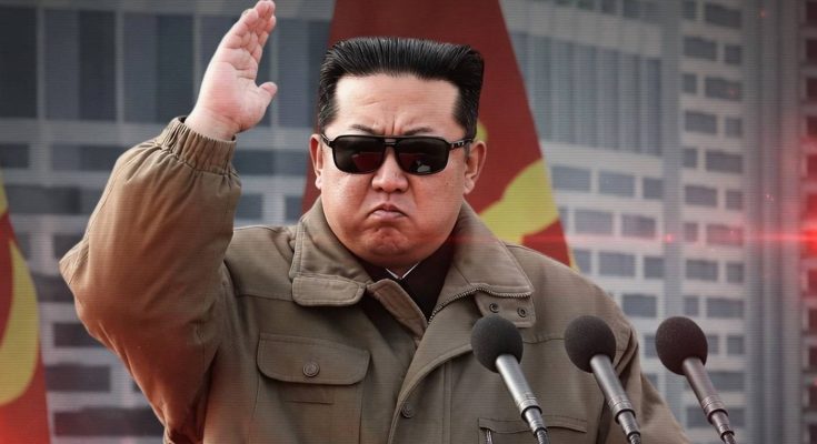 Kim Jong-un waving salute with flag