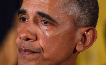 close-up of Barack Obama with visible tears on his cheek, emotional expression, yellow